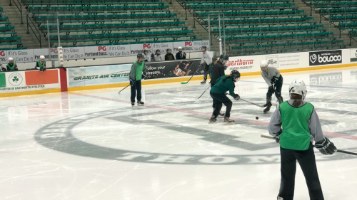 IM Hockey participants playing in a game at Thompson Arena