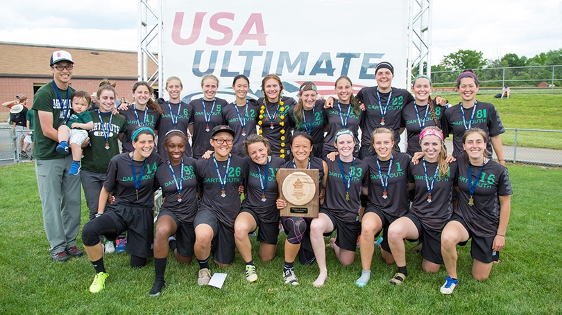 the women's ultimate frisbee team posing together in their uniforms