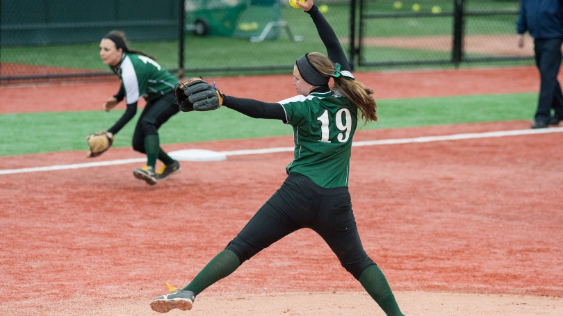 A softball pitcher pitches the ball.